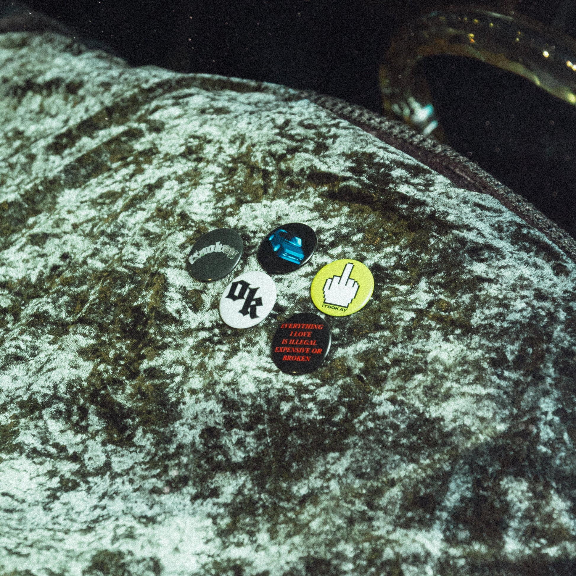 Pins from the brand ITSOKAY on a dashboard