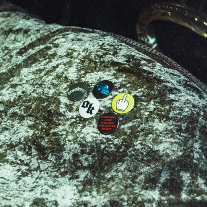 Pins from the brand ITSOKAY on a dashboard